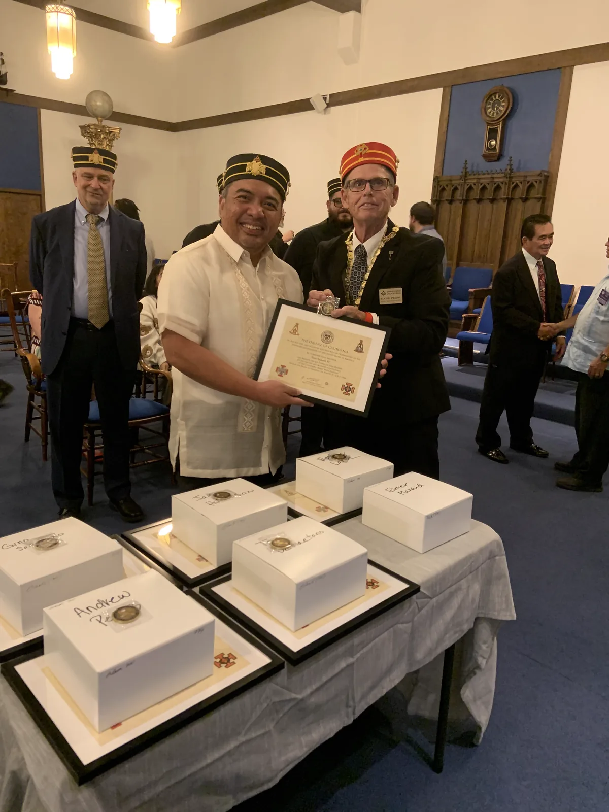 A new member receiving his certificate in a barong tagalog