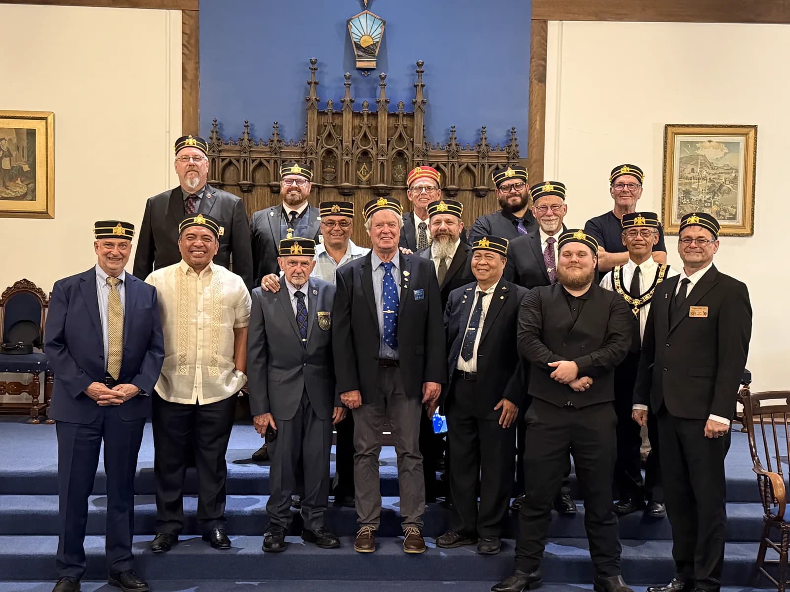 Group photo of the newly capped Scottish Rite Masons with officers at the altar