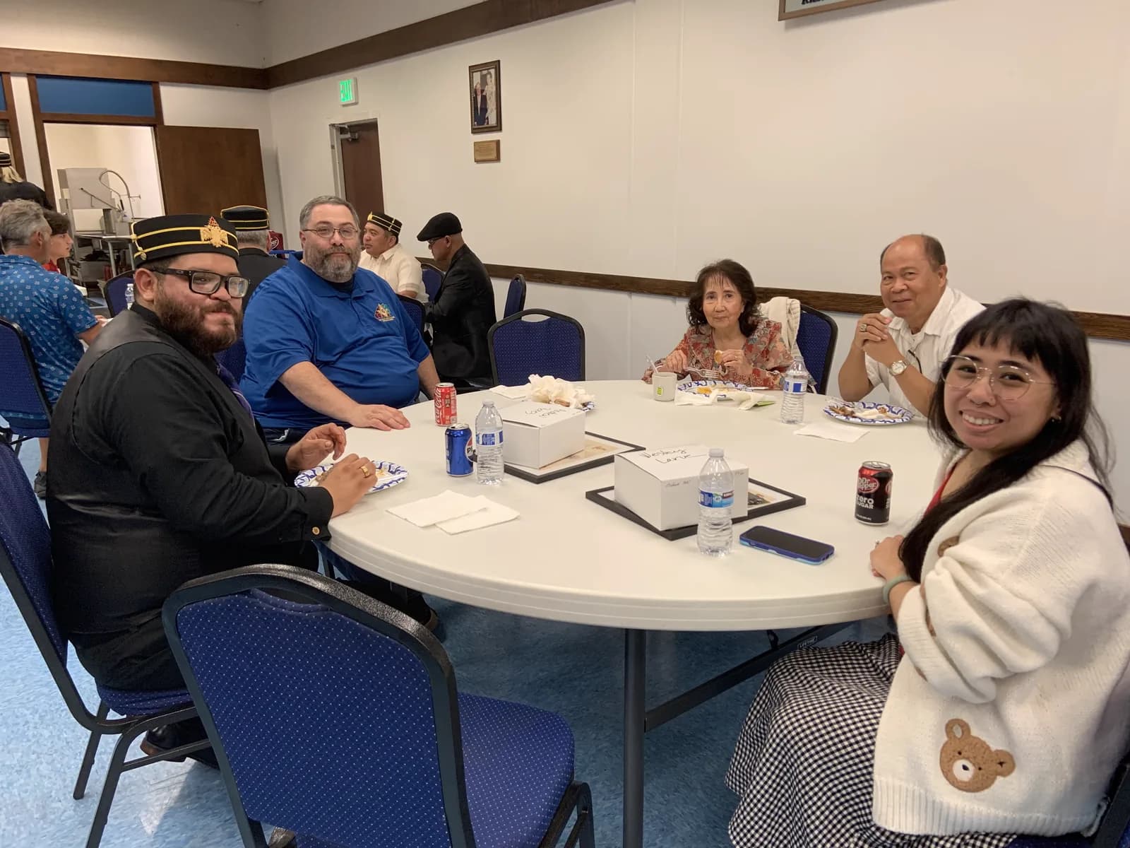 Family and friends seated together at the reception